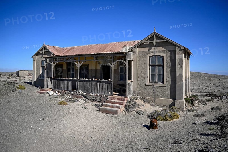 Dilapidated building in the desert sand, Pomona, restricted diamond area, near Lüderitz, Karas region, Namibia