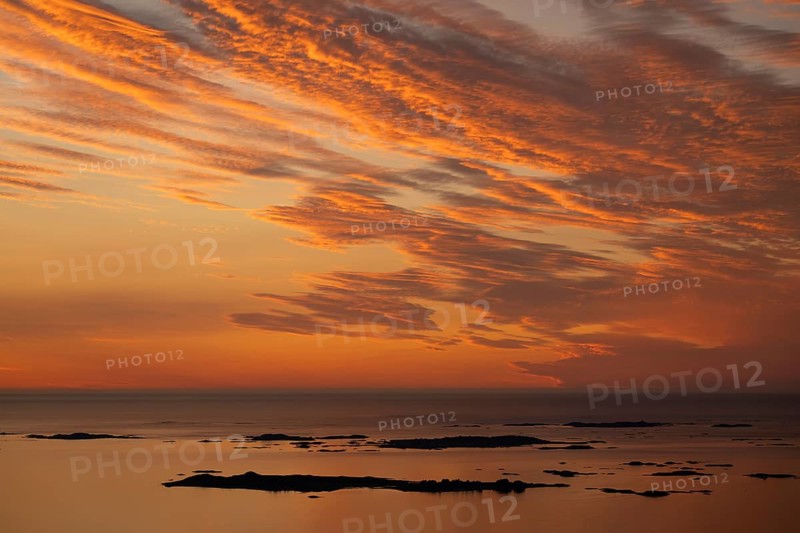 Offshore islands and skerries, sea, dramatically illuminated clouds, sunset, Otroya or Otrøya island, Møre og Romsdal, Norway