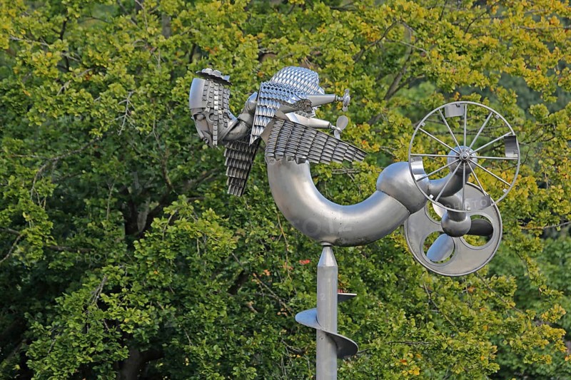 Sculpture Birdman by Albert Sous, modern art, abstract art, stainless steel, metal sculpture, bizarre bizarre bird figure, mythical creature, hybrid creature, wings, flying, wheel, detail, Bastinsweiher, Rhineland, Stolberg, North Rhine-Westphalia, Germany