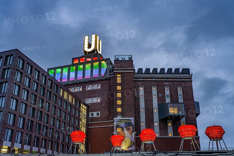 Illuminated sculptures of Dortmund roses in front of Dortmund's landmark U, Centre for Art and Creativity at dusk, Dortmund, North Rhine-Westphalia, Germany