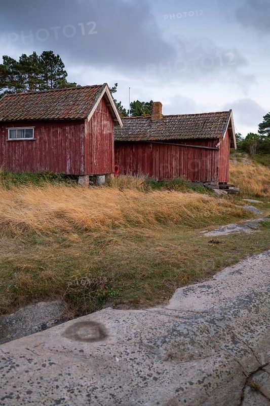 Falun red or Swedish red boathouses by the sea, Resö Island, Bohuslän, Skagerrak, Sotenäs, Västra Götalands län, Sweden