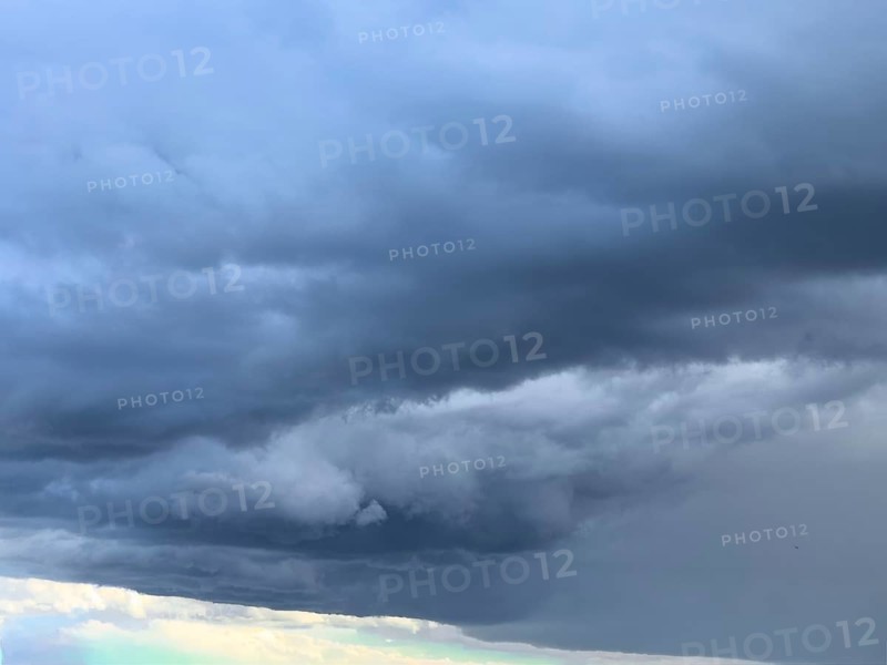 Gathering low pressure area with rain front dark stratus clouds Nimbostratus clouds, international