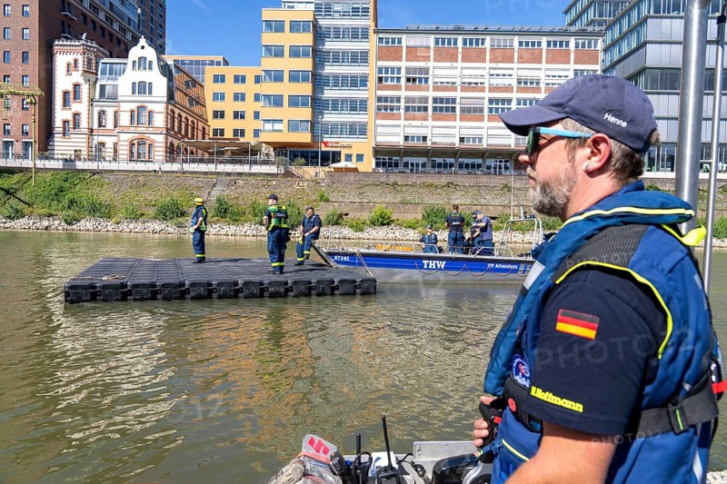 Transport of a floating platform with the jet-float system, this can be used as a work platform, jetty or bridge, water hazards specialist group, multi-purpose boat accompanied, in Düsseldorf, at the major exercise FÜLEX25, lasting several days, of the THW, Federal Agency for Technical Relief, North Rhine-Westphalia, over 3500 volunteers from the 127 North Rhine-Westphalia local associations practise many different deployment scenarios over 4 weekends