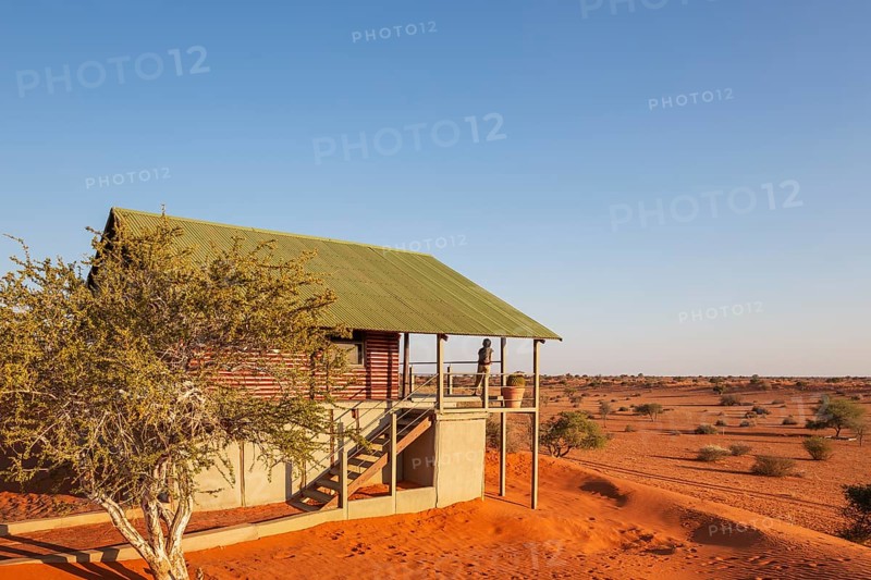 Some of the chalets of the Bagatelle Kalahari Game Ranch are built on top of a sand dune. Kalahari Desert, Namibia