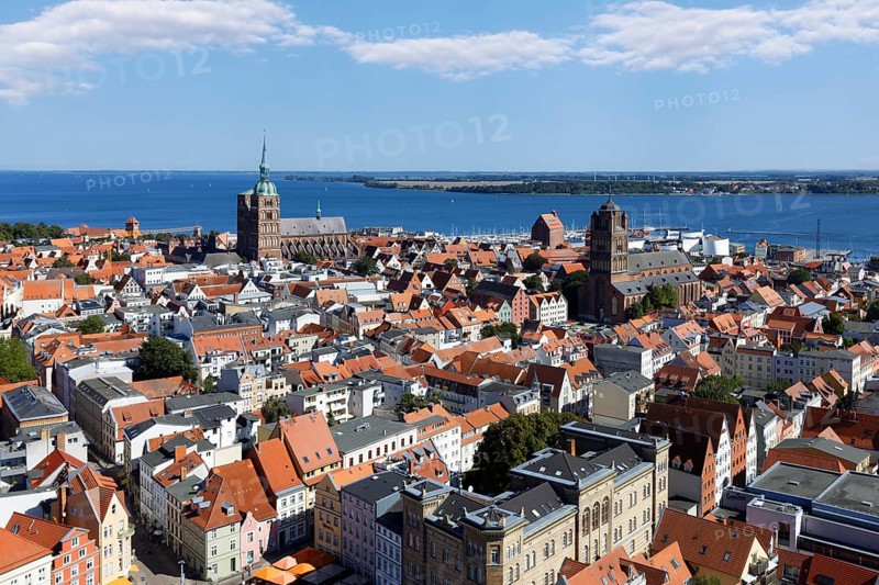 View from a height of 84 metres over the city, Neuer Markt below, St. Nikolai Church to the rear left, St. Jakobi Church to the right, Rügen Island behind, St. Mary's Church, also known as Marienkirche, basilica, late Gothic, three naves with transept, first mentioned in 1298, Neuer Markt, Old Town, UNESCO World Heritage Site, Hanseatic City of Stralsund, Mecklenburg-Western Pomerania, Germany