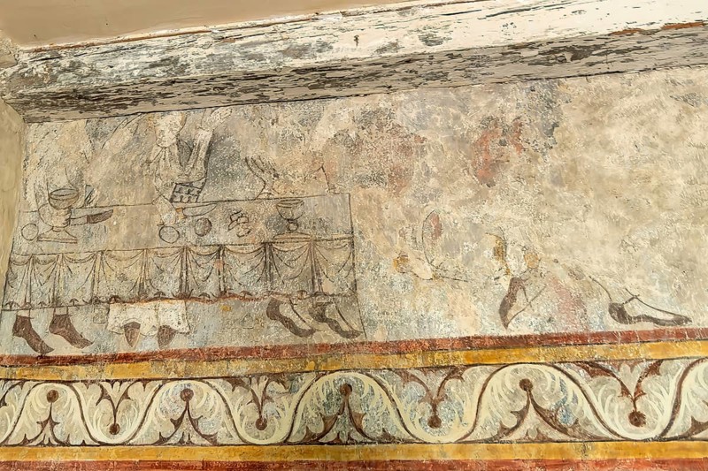 Saint Jean Chapel features ancient wall paintings showcasing religious figures with vibrant colors and intricate details. Champeix village. Puy de Dome. Auvergne Rhone Alpes. France
