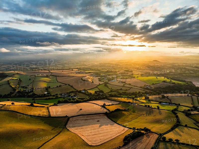 Sunset of Fields and Farms over Devon from a drone, Torquay, Torbay, Devon, England, United Kingdom