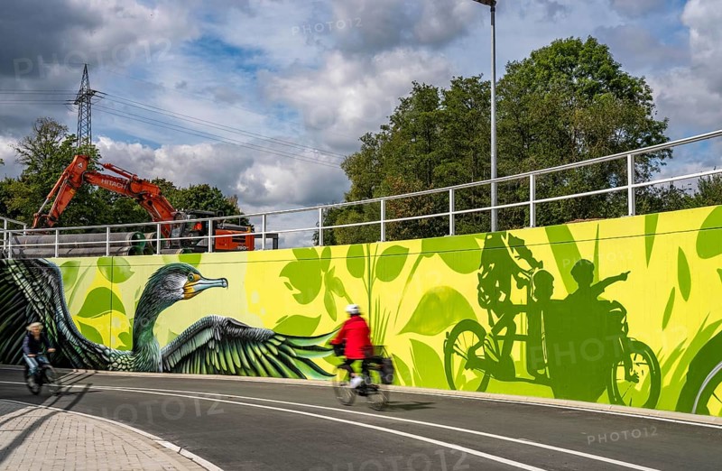 New bicycle tunnel at the junction of the B51 and Warendorfer Straße, in Münster, a bicycle and pedestrian tunnel, 150 metres long, 5.50 metres wide, crosses under the busy roads so that cyclists and pedestrians can pass without crossing, route to and from Münster city centre, visually designed with local motifs as murals, by Lackaffen.de, modern bicycle infrastructure, North Rhine-Westphalia, Germany