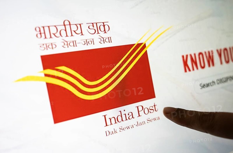 New Delhi, India – August 23, 2025: In this photo illustration, the India Post logo is seen on a digital display. The Indian Department of Posts has announced a temporary suspension of most postal services to the United States from Aug 25