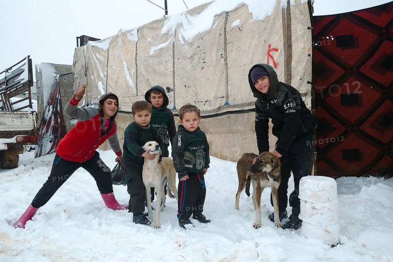 Displaced Syrian families and children living in refugee camps during harsh winter conditions, facing snow, cold weather, and difficult humanitarian circumstances. Aleppo, Syria January 01, 2022, Aleppo, Syria