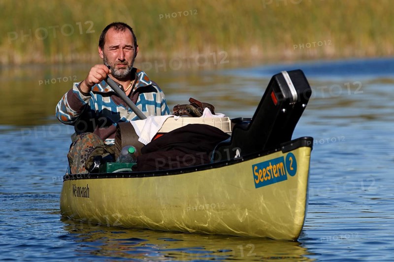 Canoeists in a canoe, Müritz National Park, Mecklenburg-Western Pomerania, Germany
