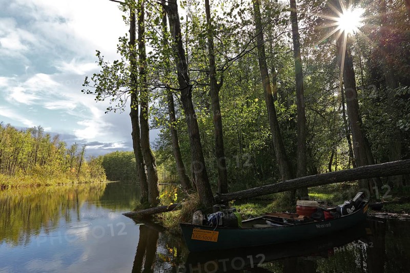 Canoe by nature photographers in Drosedower Bek, Müritz National Park, Mecklenburg-Western Pomerania, Germany
