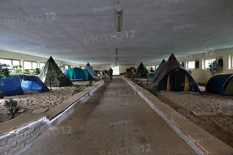 Indoor campsite in a former cattle shed at Fleether Mühle, Müritz National Park, Mecklenburg-Vorpommern, Germany
