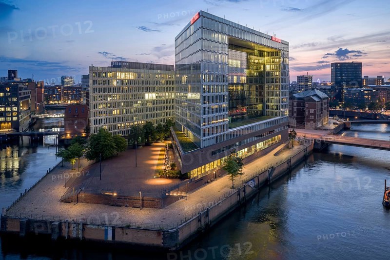Aerial view of the Spiegel building at Ericusspitze in Hamburg's HafenCity in the Brooktorkai neighbourhood at blue hour, Hamburg, Germany