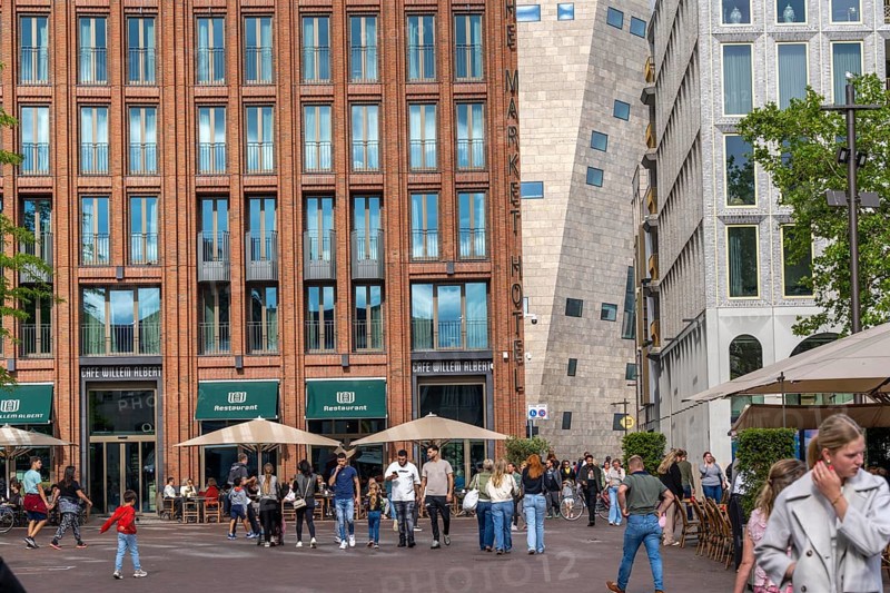 The Grote Markt in the old town of Groningen, modern facades of hotel and commercial buildings, in the centre the Forum Groningen, gastronomy, Netherlands