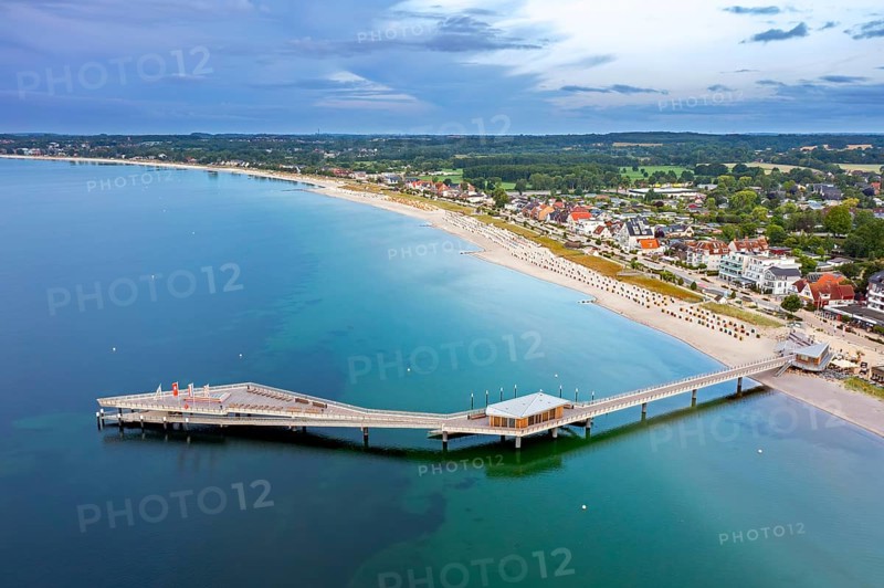 Aerial view over Seebrücke, pier and sandy beach at seaside resort Haffkrug along the Baltic Sea, Scharbeutz, Schleswig-Holstein, Germany