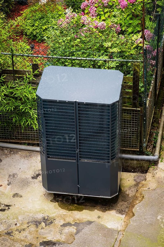 Heat pump in a backyard in Wuppertal, Germany, digitally reworked