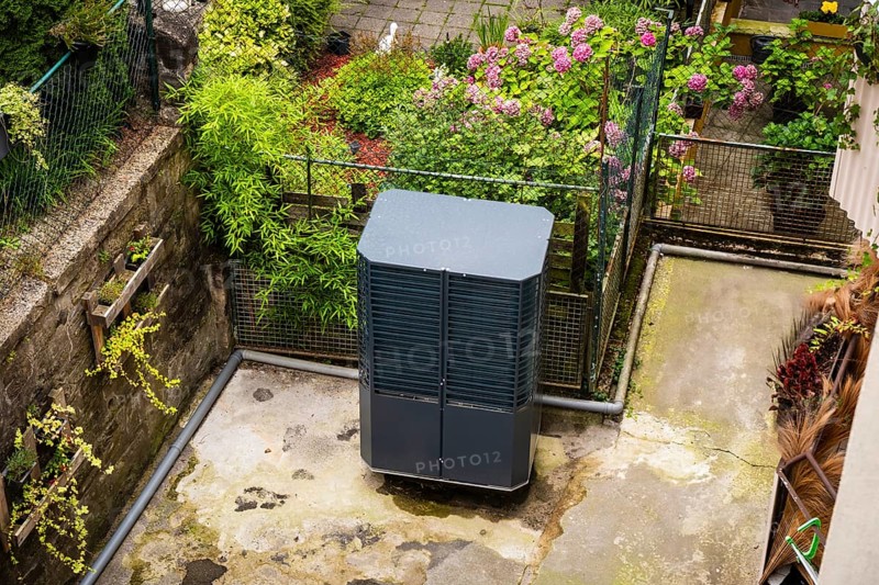 Heat pump in a backyard in Wuppertal, Germany, digitally reworked
