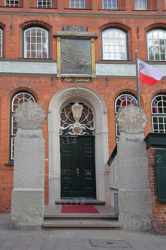 Entrance to the Schiffergesellschaft restaurant with painting, brick building, Old Town, Lübeck, Schleswig-Holstein, Germany