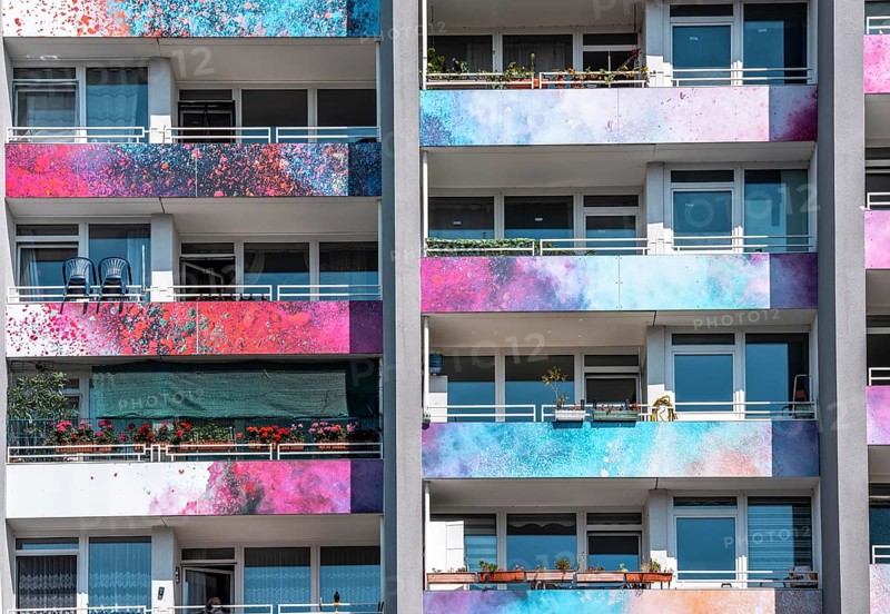 High-rise residential building, in Essen-Steele, with colourfully designed façade, balcony balustrades, after renovation, North Rhine-Westphalia, Germany