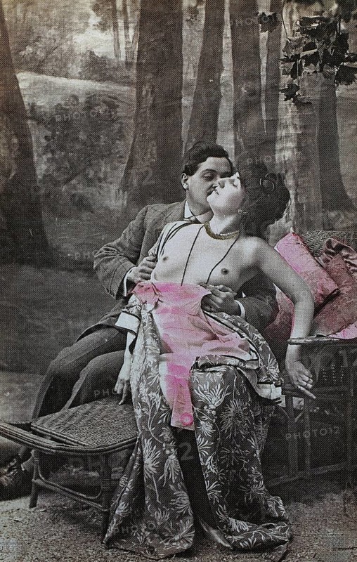 Female nude from around 1899, erotic postcard, playgirl, romantic couple in an intimate moment on a park bench in a forest, coloured, reproduction from a photo around the turn of the century, historical, digitally restored reproduction of an old original, exact date unknown