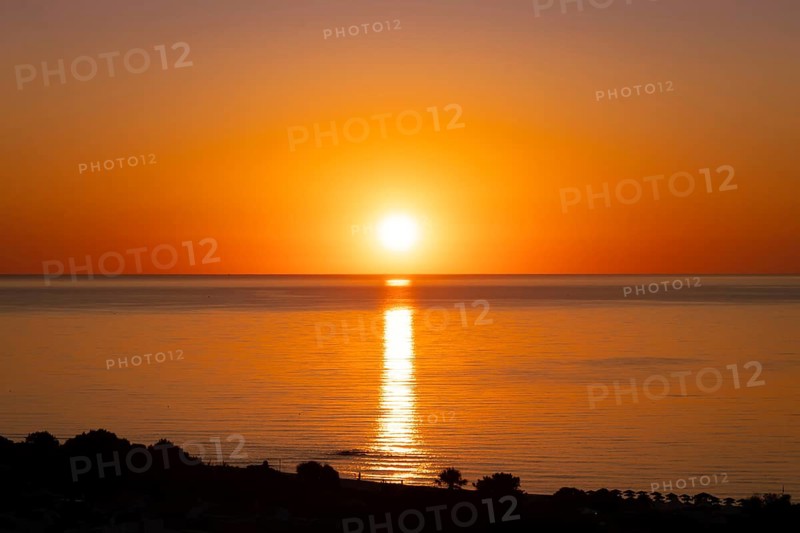 The sun rises on the Costa Rei, a stretch of coastline on the Italian Mediterranean island of Sardinia, Monte Nai, Costa Rei, Sardinia, Italy