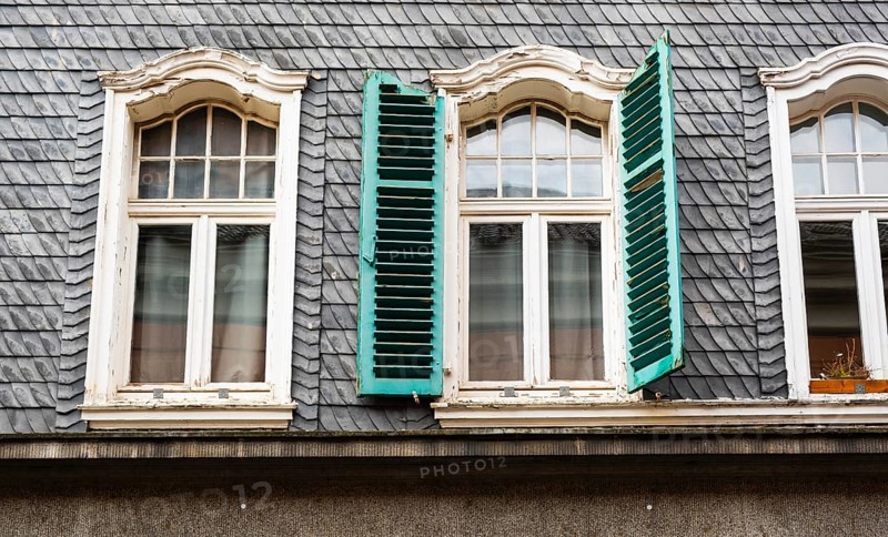 Green shutters on a slate-roofed house in the historic centre of Wuppertal, Wuppertal, Germany