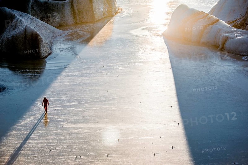 Man standing at Vatnajökull glacier, Astronaut, Ice, Rocks, Lake, Sunset, Winter, Cold, Iceland* Man standing at Vatnajokul, Spaceman, Ice, Rocks, Lake, Sunset, Cold, Iceland