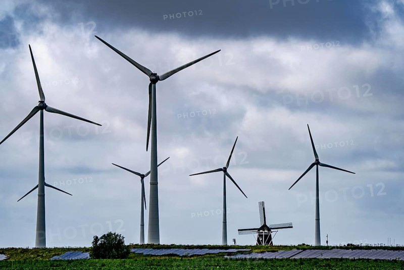 Westereems and Growind wind farms, over 80 wind turbines in total, at the seaport of Eemshaven, province of Groningen, in the north-west of the Netherlands, historic Goliath windmill from 1897, solar farm on sea dike, Slaperdijk, a good 5 kilometres long