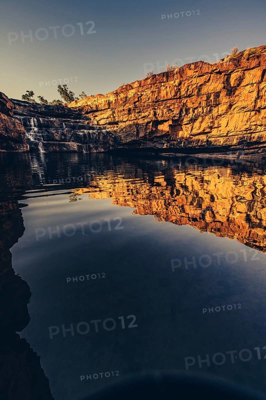 Bell Gorge waterfall, a body of water in north-west Australia in the Kimberley. Sunrise in the outback, Australia