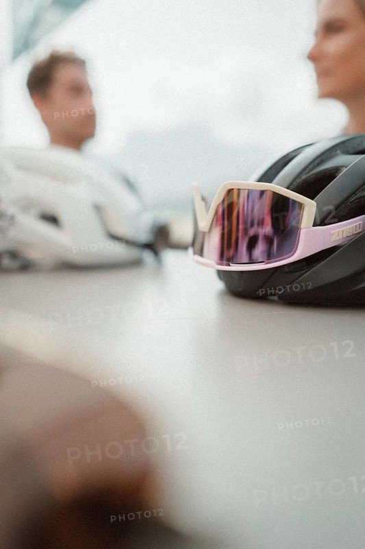 Young man taking a coffee break while riding his racing bike on Lake Garda. Sunny weather and dolce vita