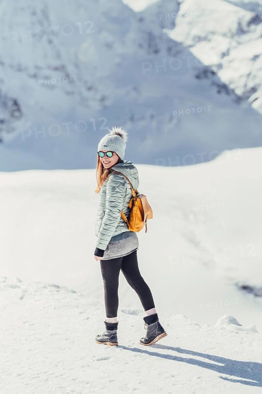 Woman in wintry surroundings in the Engadine in Switzerland