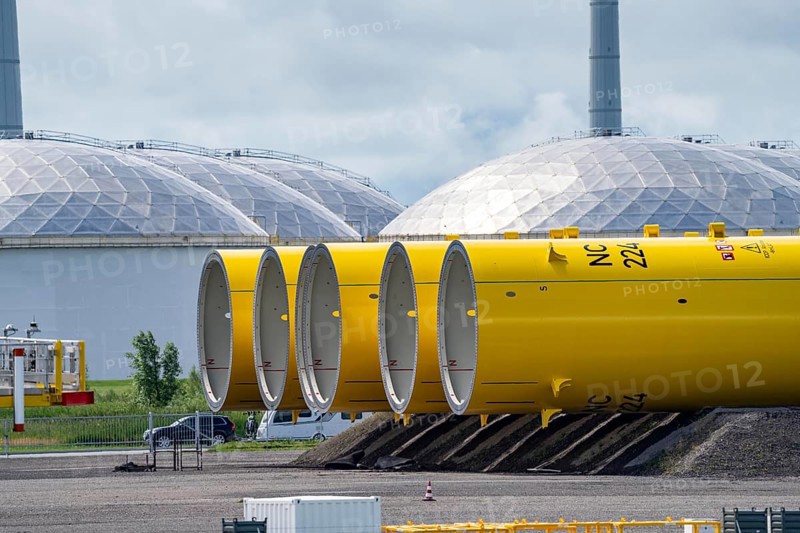 The seaport of Eemshaven, Julianahaven Basin, where the foundation structures, monopiles, for offshore wind farms are stored, which then support the actual wind turbines, the components are transported to the wind farms in the North Sea on large workboats and anchored to the seabed, where the wind turbines are then built, Eemshaven, Netherlands