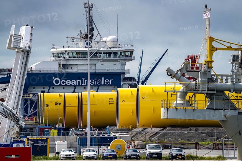 The seaport of Eemshaven, Julianahaven Basin, where the foundation structures, monopiles, for offshore wind farms are stored, which then support the actual wind turbines, the components are transported to the wind farms in the North Sea on large workboats and anchored to the seabed, where the wind turbines are then built, Eemshaven, Netherlands