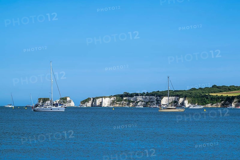 Boats on sea over Knoll Beach Studland, Poole, Dorset, England, United Kingdom