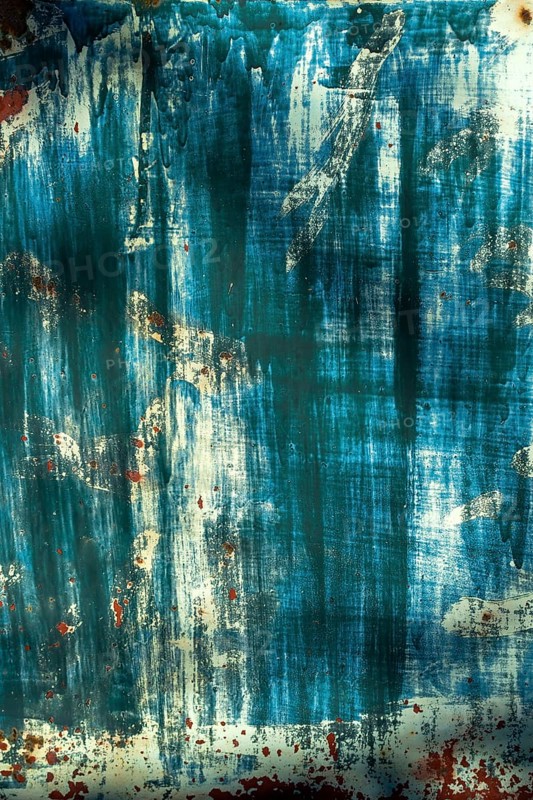 The surface displays an interplay of blue and white hues, layered textures, and hints of rust, creating an intriguing visual experience