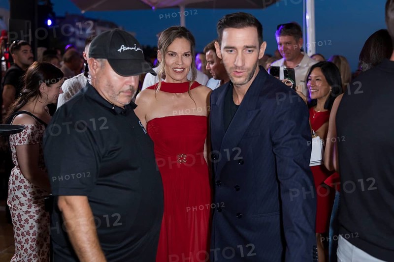 Hilary Swank and Marcel Remus walk through the crowd at the Remus Lifestyle Night on the rooftop terrace of the Pure Salt Hotel in El Toro, Magaluf, Majorca, Spain on 31/07/2025
