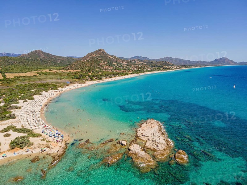 White sandy beaches and turquoise-blue sea stretch for several kilometres on the Costa Rei, a stretch of coastline on the Italian Mediterranean island of Sardinia, making the area one of the most popular holiday destinations in Europe. (Aerial view with a drone), Monte Nai, Costa Rei, Sardinia, Italy