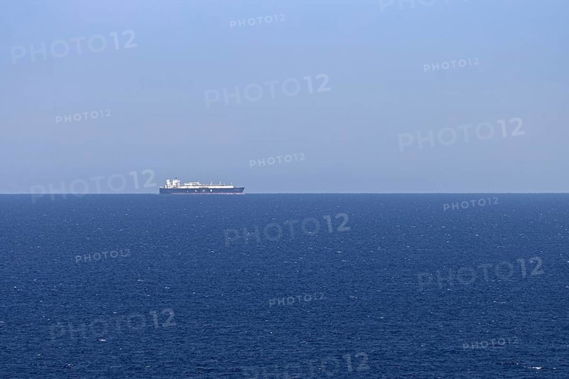 An LNG tanker sails along the Mediterranean Sea off the Costa Rei, a coastal section of the Italian Mediterranean island of Sardinia, Monte Nai, Costa Rei, Sardinia, Italy