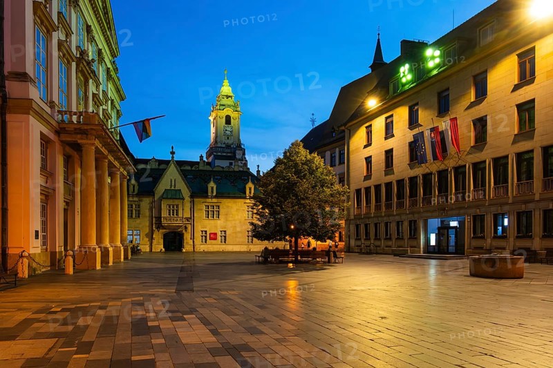 Night shot of Primitial Square with New and Old Town Hall and Primitial Palace in the historic centre of Bratislava, Slovakia