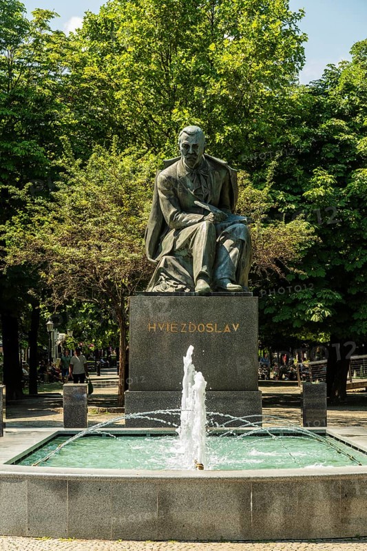 Monument to the Slovakian poet Pavol Országh Hviezdoslav on Hviezdoslav Square, promenade with trees, benches and cafés in Bratislava, Slovakia
