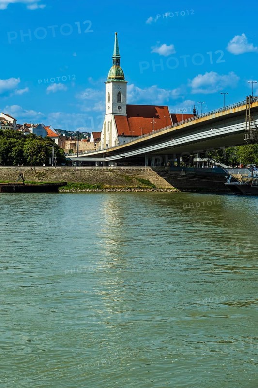 St Martin's Cathedral in Bratislava, in the foreground the Danube and the Bridge of the Slovak National Uprising in Bratislava, Slovakia