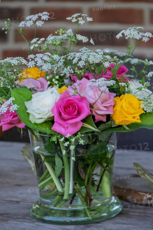 Small bouquet of flowers in a glass jar, Germany