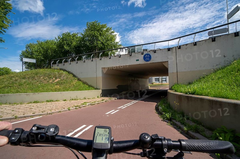 Roundabout in the Dutch city of Houten, the lanes for cars and bicycles are separated, the cycle path runs under the car lane, through subways, so that cyclists and cars can pass the intersection separately, in Houten, bicycle traffic has priority, considered a model city for modern bicycle traffic, Netherlands