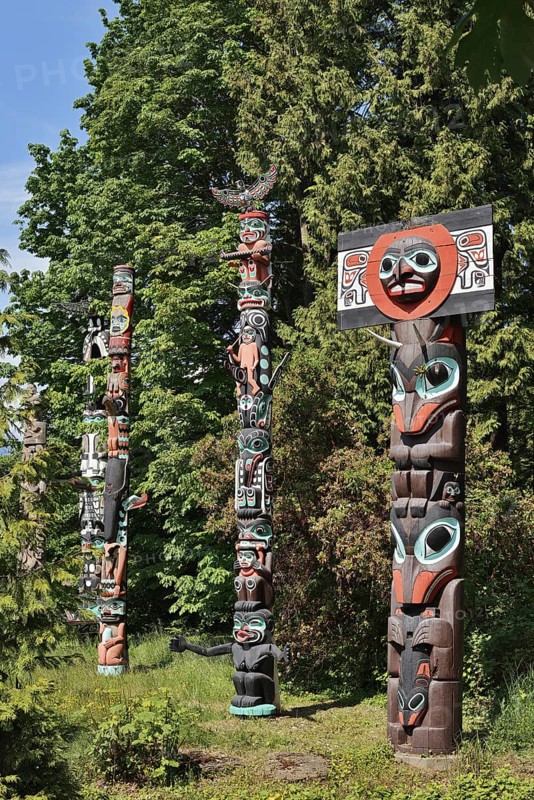Totem poles, Chief Skedans Mortuary Totem Pole and Ga'akstalas Totem Pole, Stanley Park, Vancouver, British Columbia, Canada