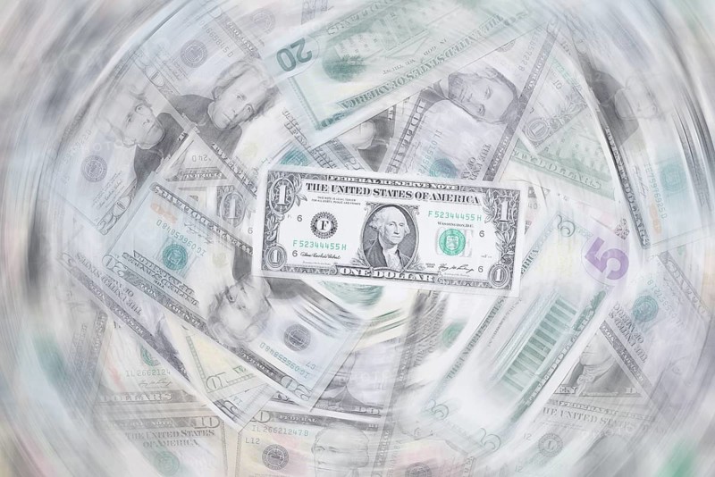 Various US dollar notes in a pile, banknotes