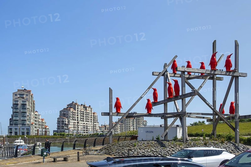 Rode Pinguins, Red Penguins, artwork by Belgian artist William Sweetlove in the harbour of Breskens along the Western Scheldt, Zeeland, Netherlands