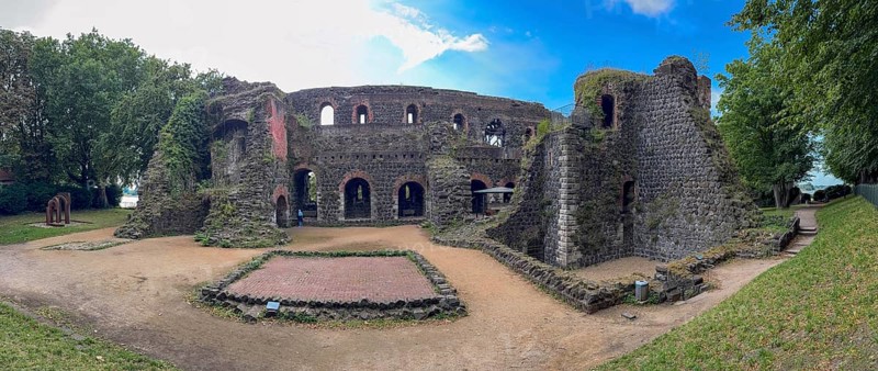 Panoramic photo of the ruins of the imperial palace of Emperor Frederick I Barbarossa, Kaiserswerth, Düsseldorf, North Rhine-Westphalia, Germany, built in the Middle Ages around 1184 on the left in the background of today's banks of the Rhine