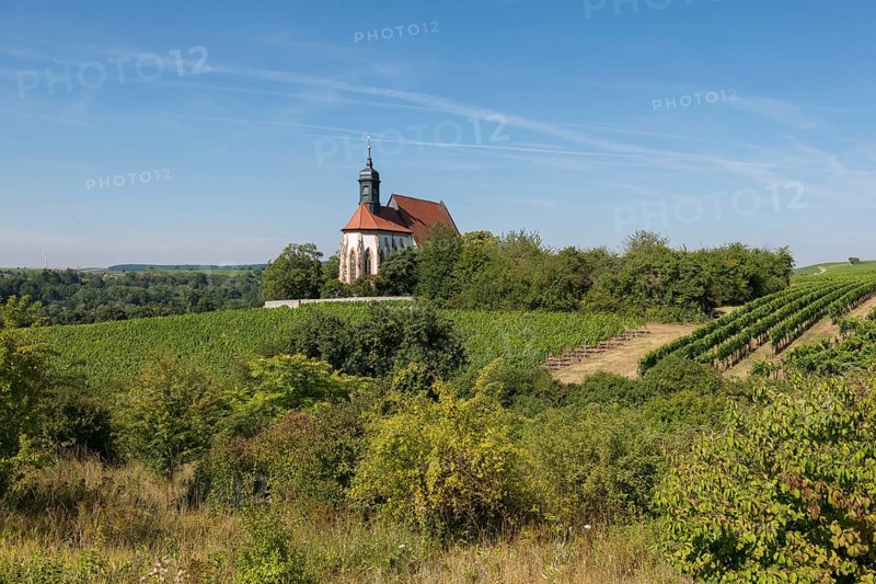 Pilgrimage church Maria im Weingarten, on a hill surrounded by vineyards with blue sky and green landscape, near Volkach am Main, Lower Franconia, Mainfranken, Bavaria, Germany