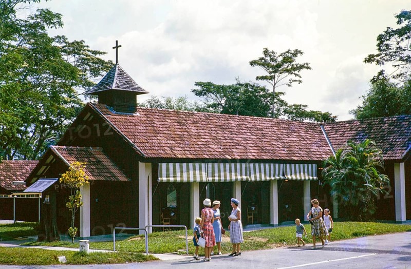 European women and children outside Christian chapel or church, from a series about Singapore and Johor Bahru, Malaysia south east Asia c 1963 location unknown possibly a garrison settlement